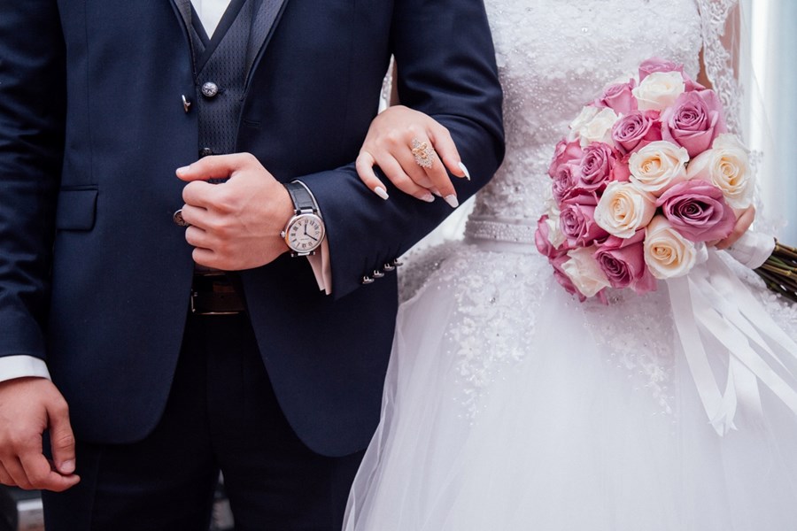 Free bride holding flower bouquet image, public domain CC0 photo.